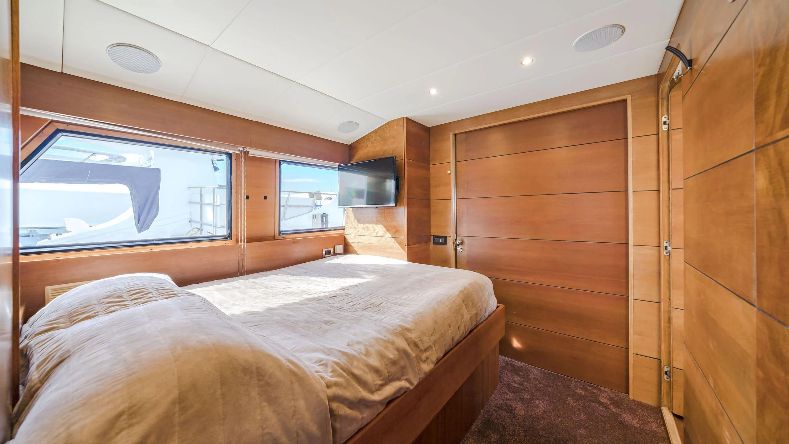 a room with a bed and a window aboard FIORENTE Yacht for Sale