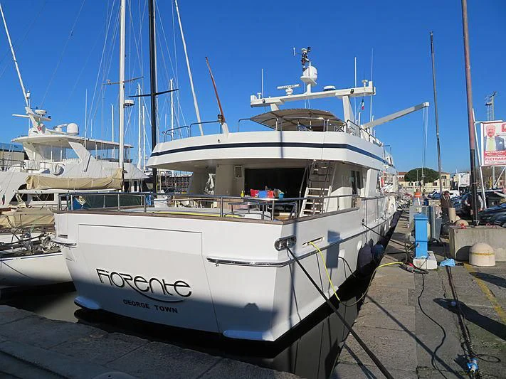 a large white boat in a dock aboard FIORENTE Yacht for Sale