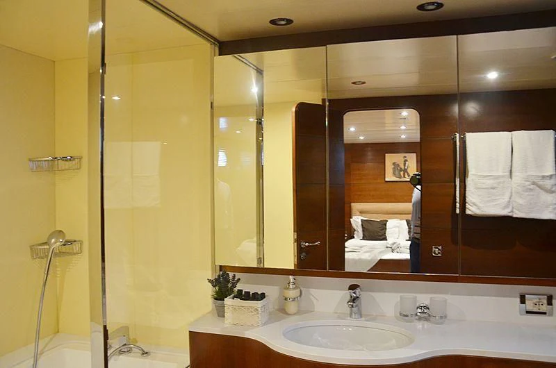 a bathroom with a large mirror aboard FIORENTE Yacht for Sale