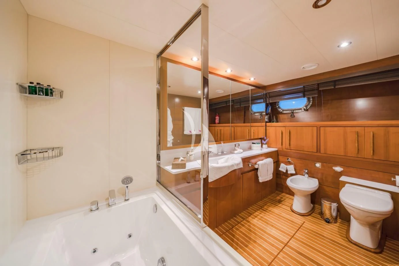 a bathroom with a tub toilet and sink aboard FIORENTE Yacht for Sale