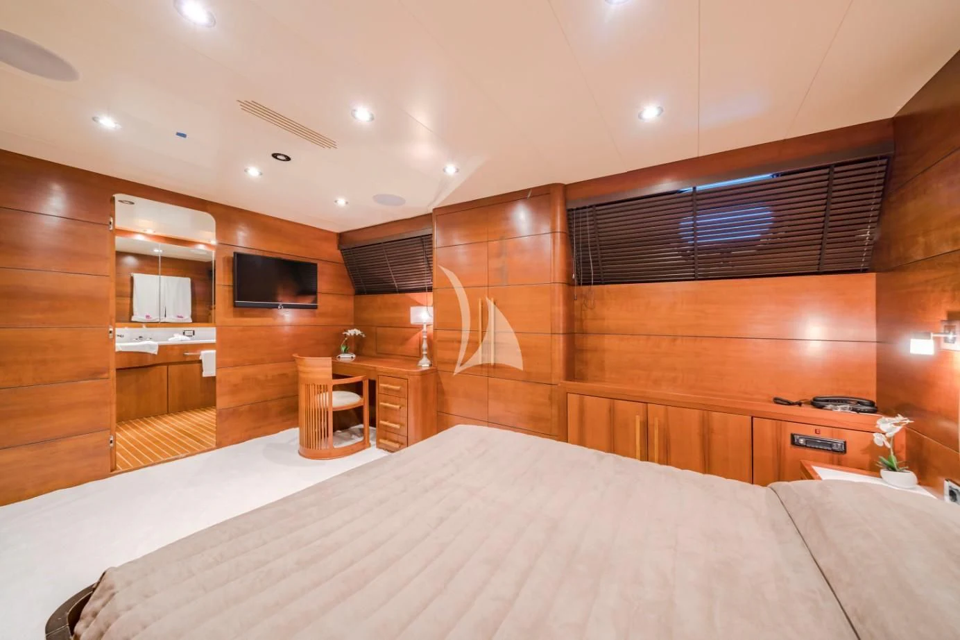 a room with a bed and a desk aboard FIORENTE Yacht for Sale