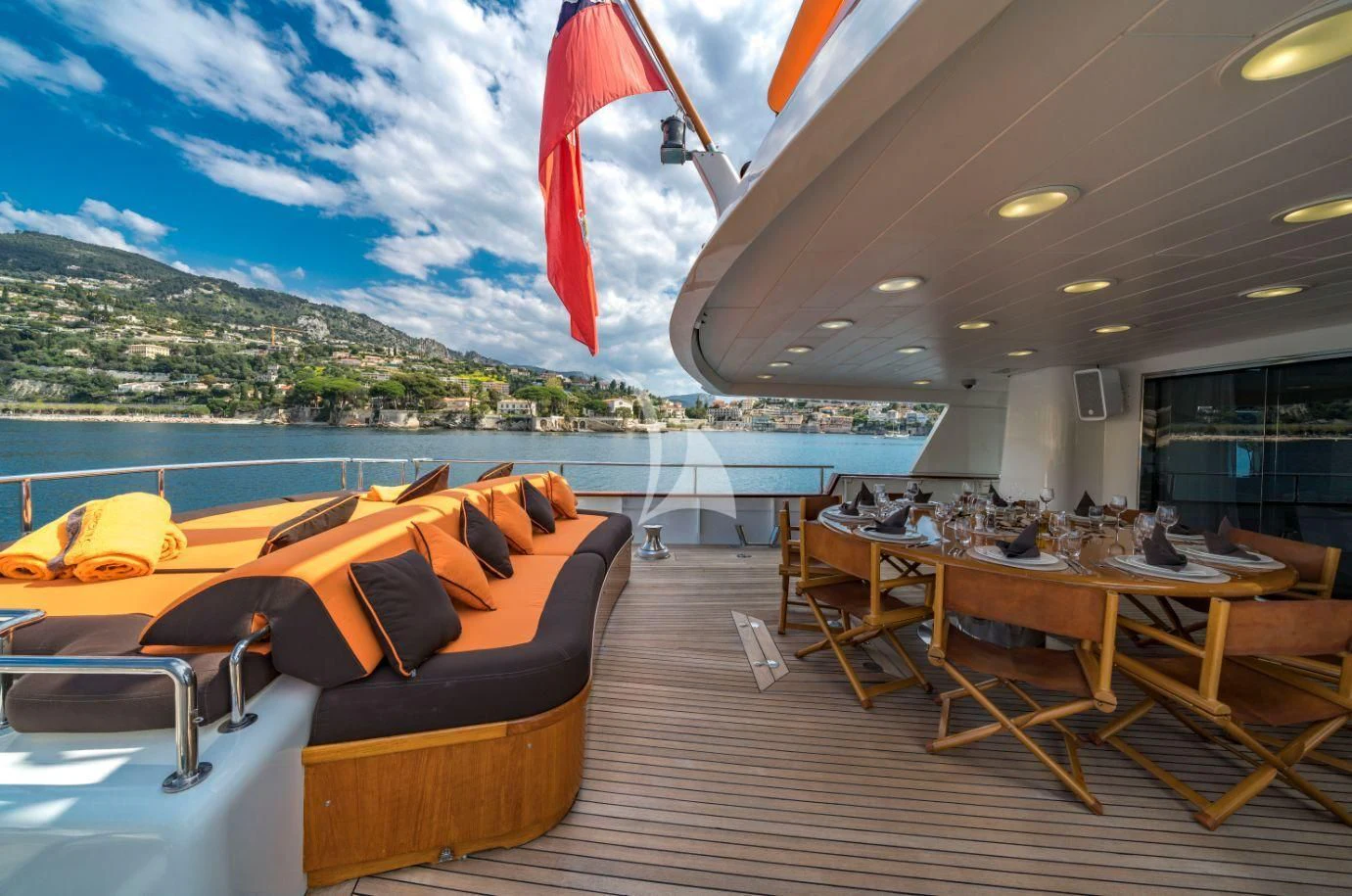 a room with a table and chairs and a large body of water aboard FIORENTE Yacht for Sale