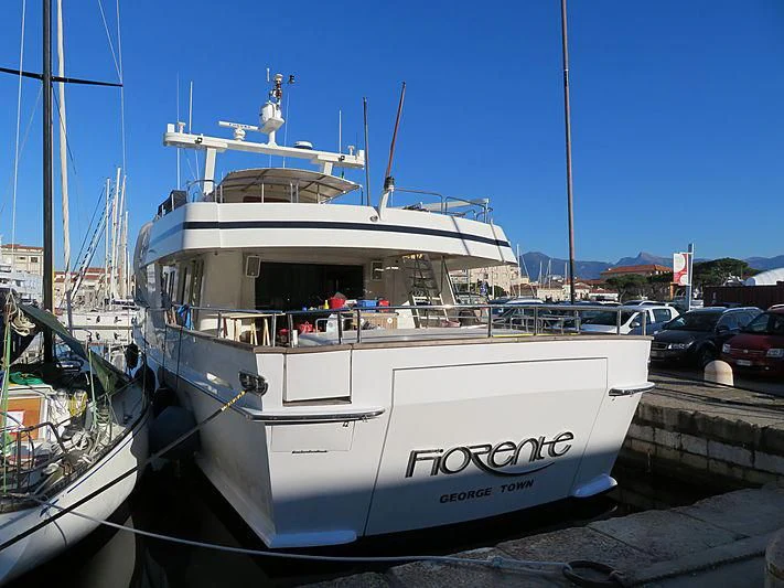 a white boat in a dock aboard FIORENTE Yacht for Sale