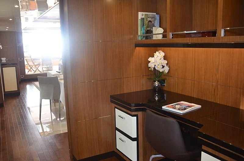 a room with a table and chairs aboard FIORENTE Yacht for Sale