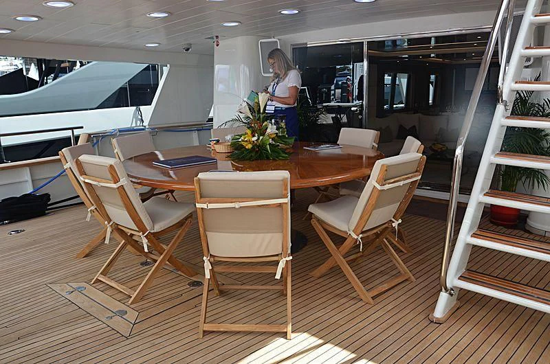 a room with a table and chairs aboard FIORENTE Yacht for Sale
