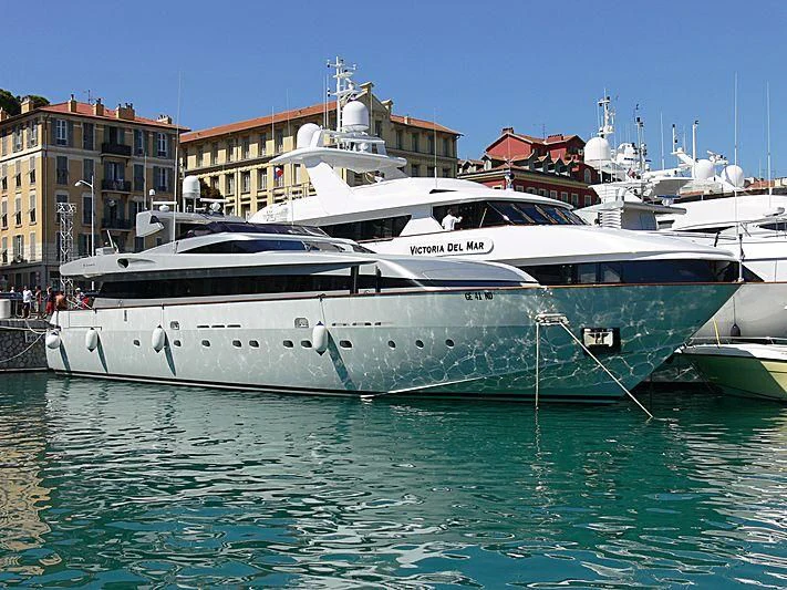 a large white yacht docked aboard THUNDERBALL I Yacht for Sale