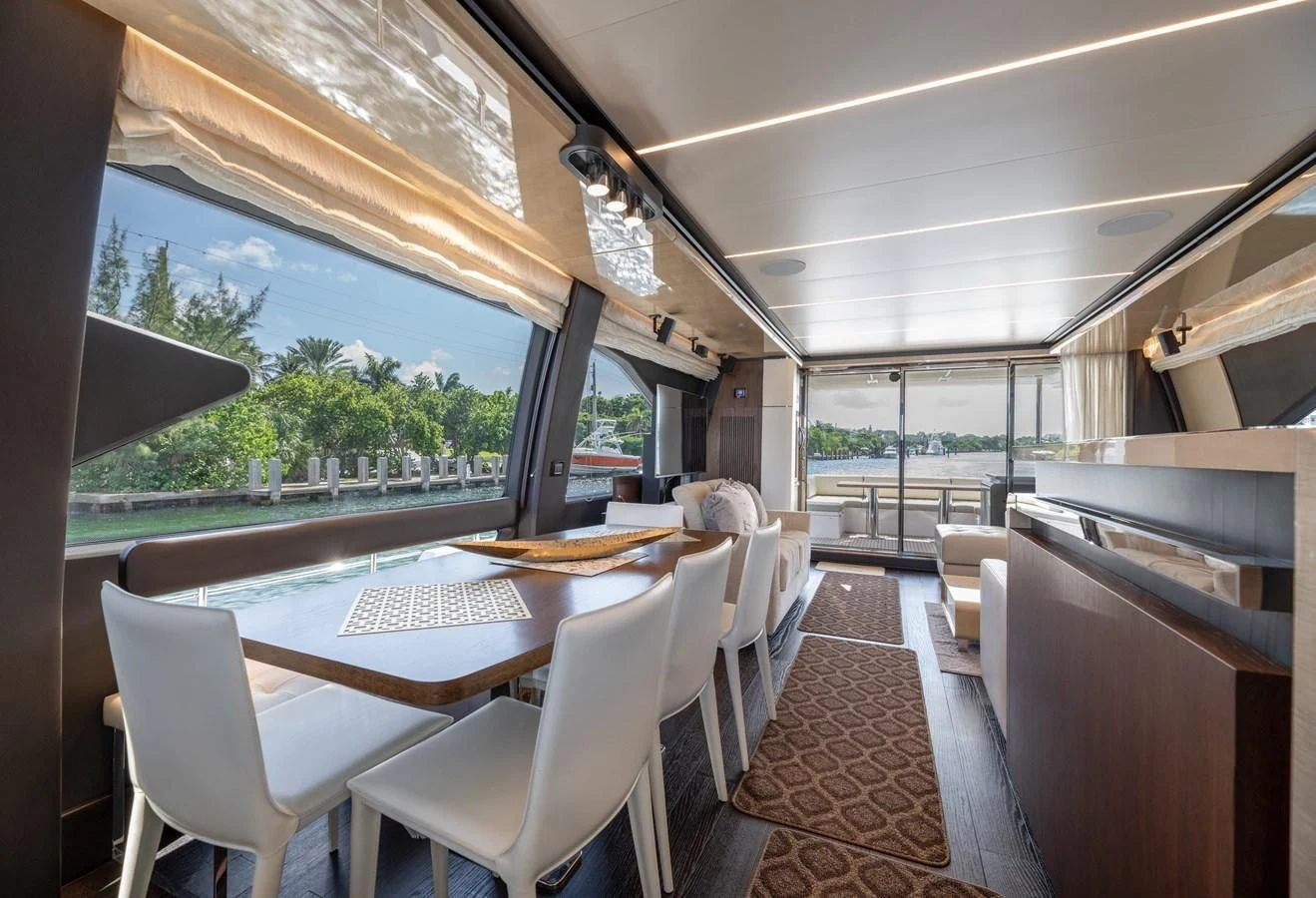 a room with a table and chairs aboard BAR BAT VIA Yacht for Sale