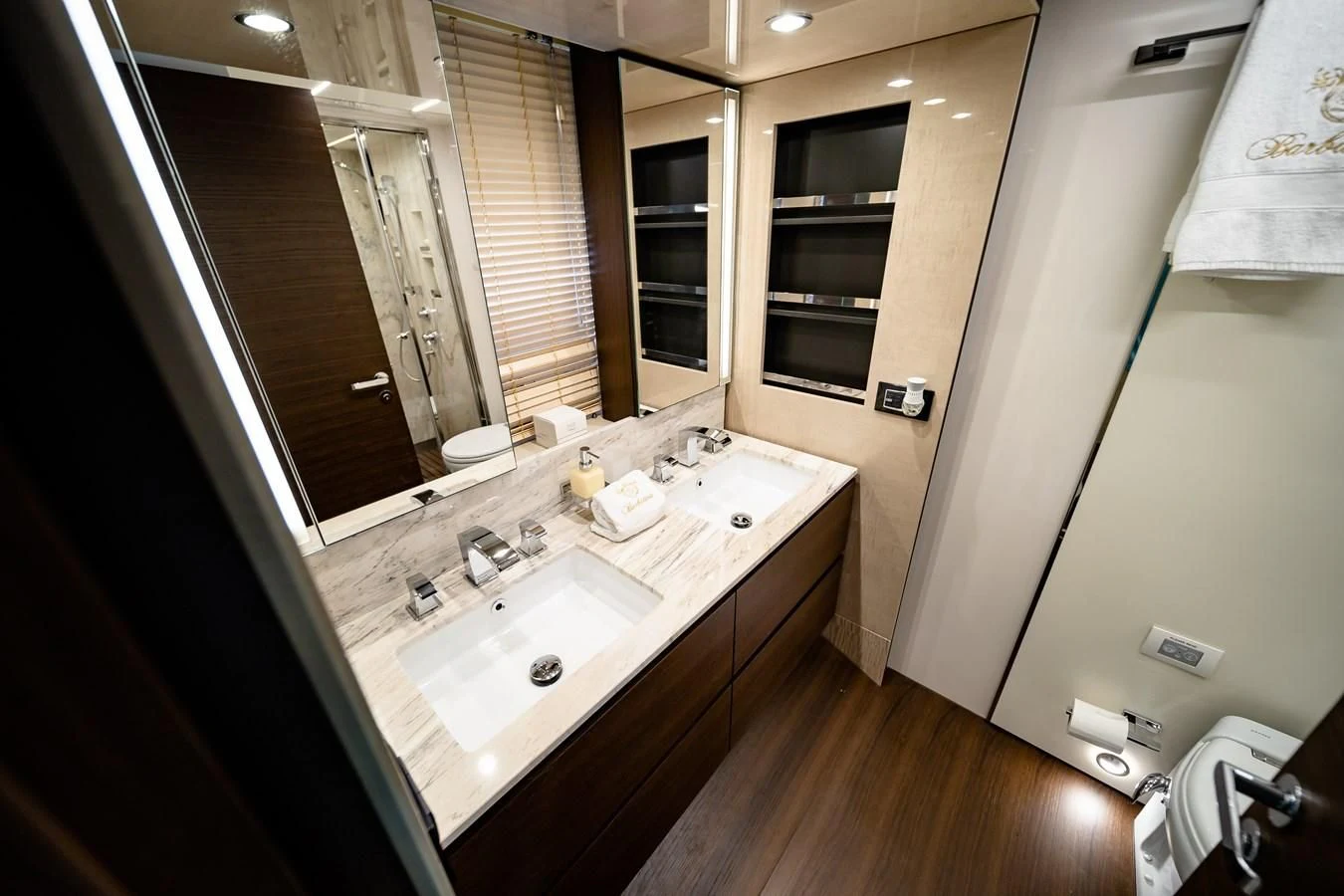 a bathroom with a large mirror aboard BAR BAT VIA Yacht for Sale