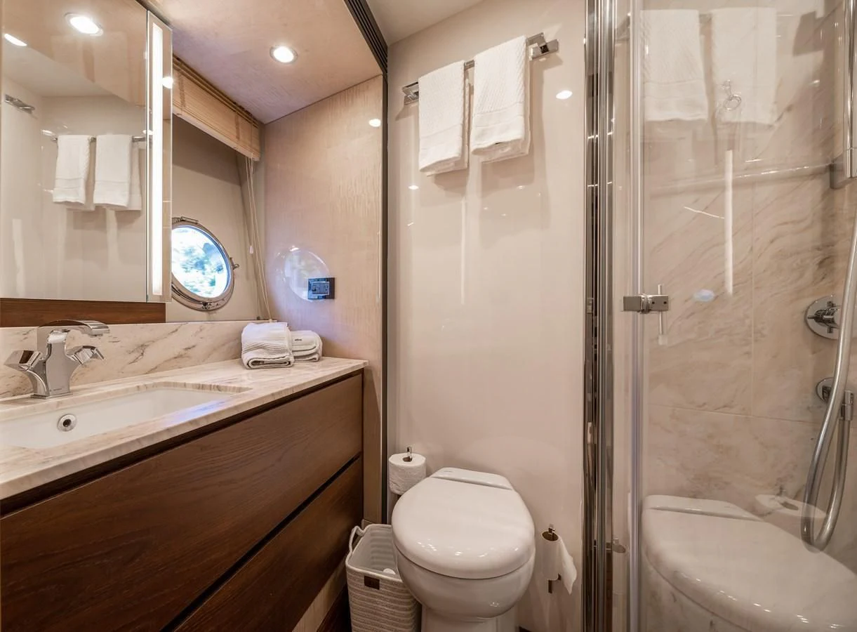 a bathroom with a shower and sink aboard BAR BAT VIA Yacht for Sale