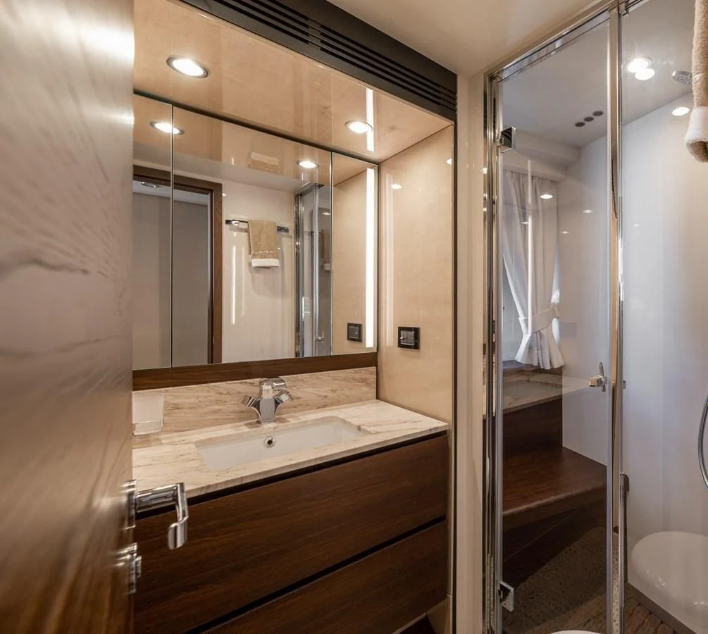 a bathroom with a large mirror aboard BAR BAT VIA Yacht for Sale