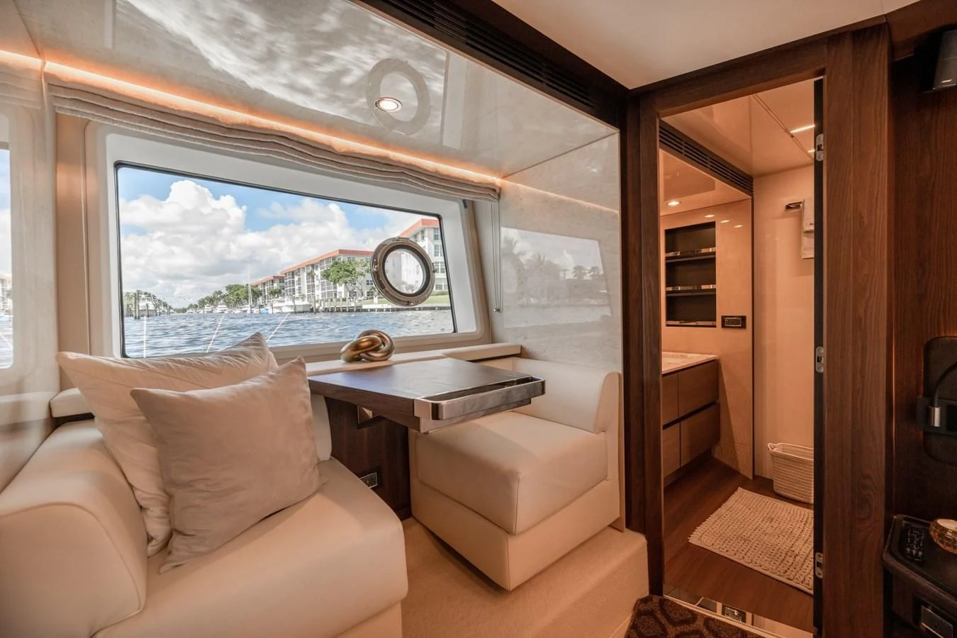 a room with a couch and a table aboard BAR BAT VIA Yacht for Sale