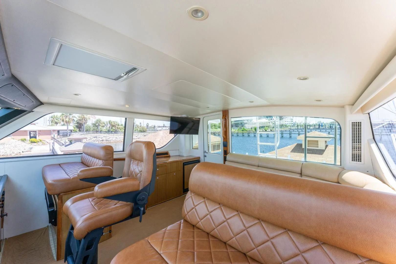 inside of a vehicle with a large window and a view of the trees aboard SALT STRUK Yacht for Sale
