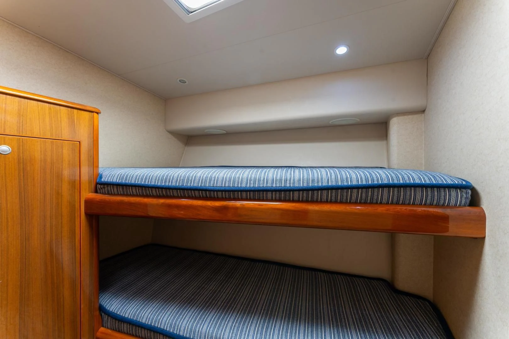 a wooden bunk bed aboard SALT STRUK Yacht for Sale