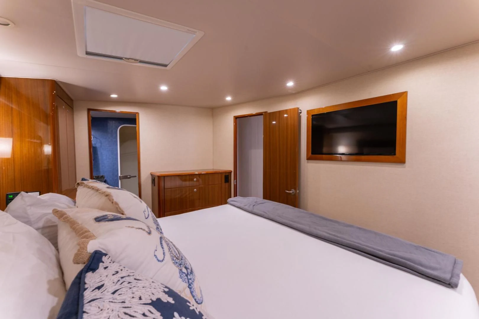 a hotel room with a bed and a tv on the wall aboard SALT STRUK Yacht for Sale