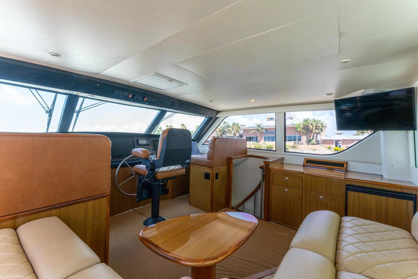 inside of a vehicle with a desk and chairs and a table aboard SALT STRUK Yacht for Sale
