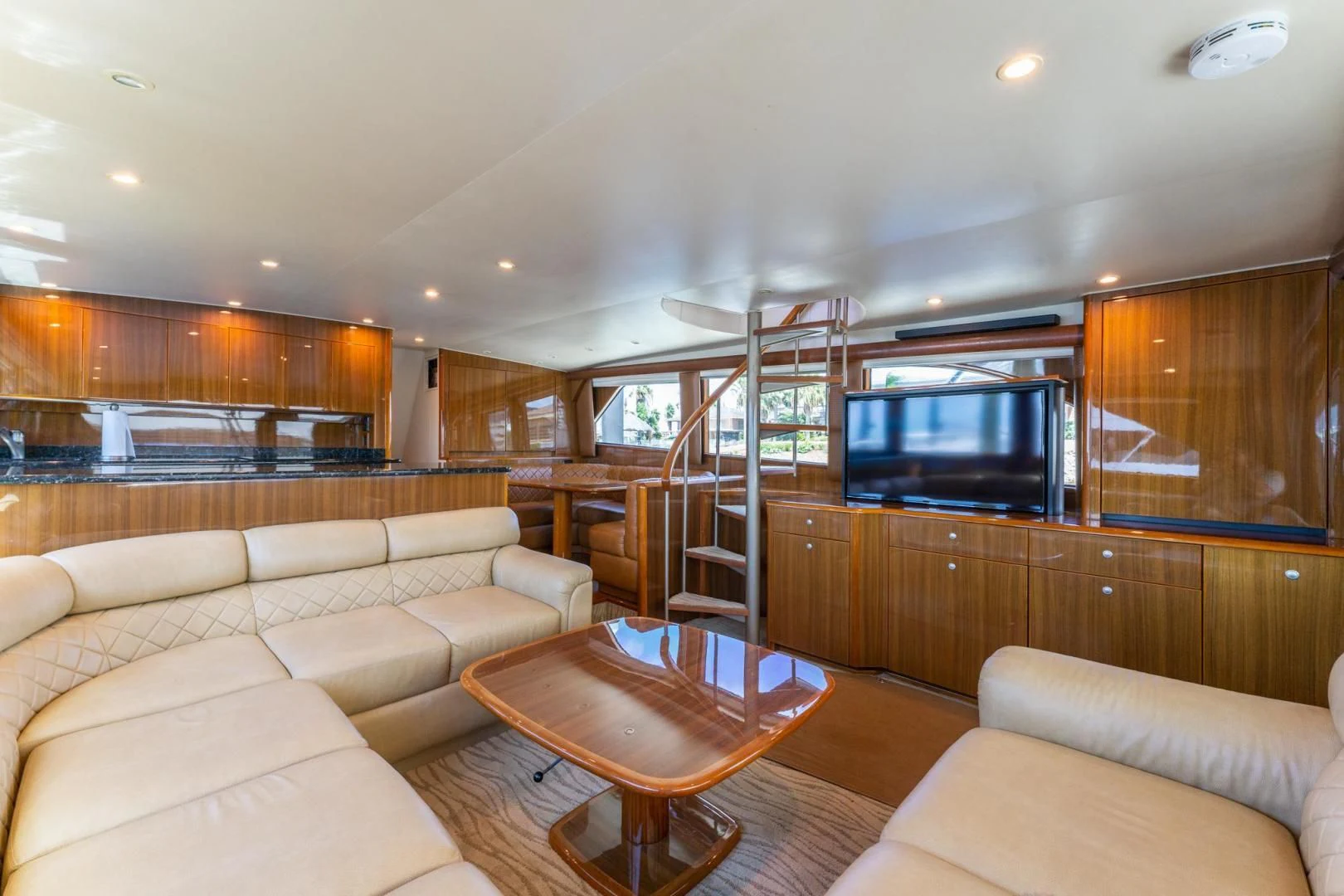 a living room with a large television aboard SALT STRUK Yacht for Sale