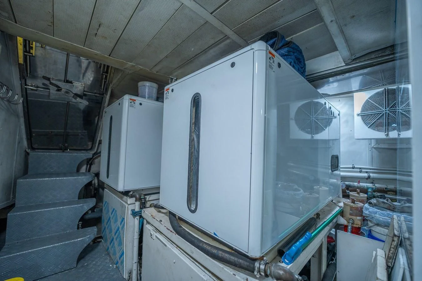 a large white machine in a room aboard 80 CARAT Yacht for Sale