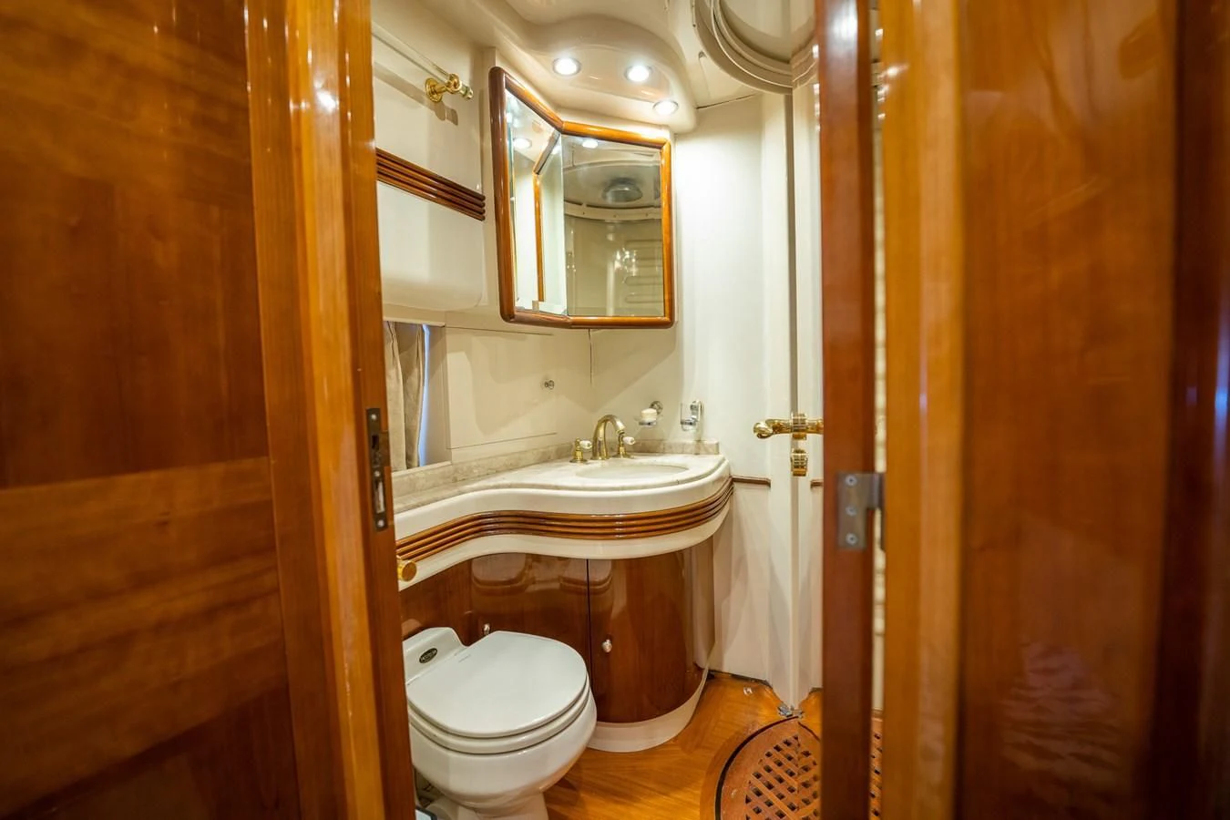 a bathroom with a sink toilet and a mirror aboard 80 CARAT Yacht for Sale