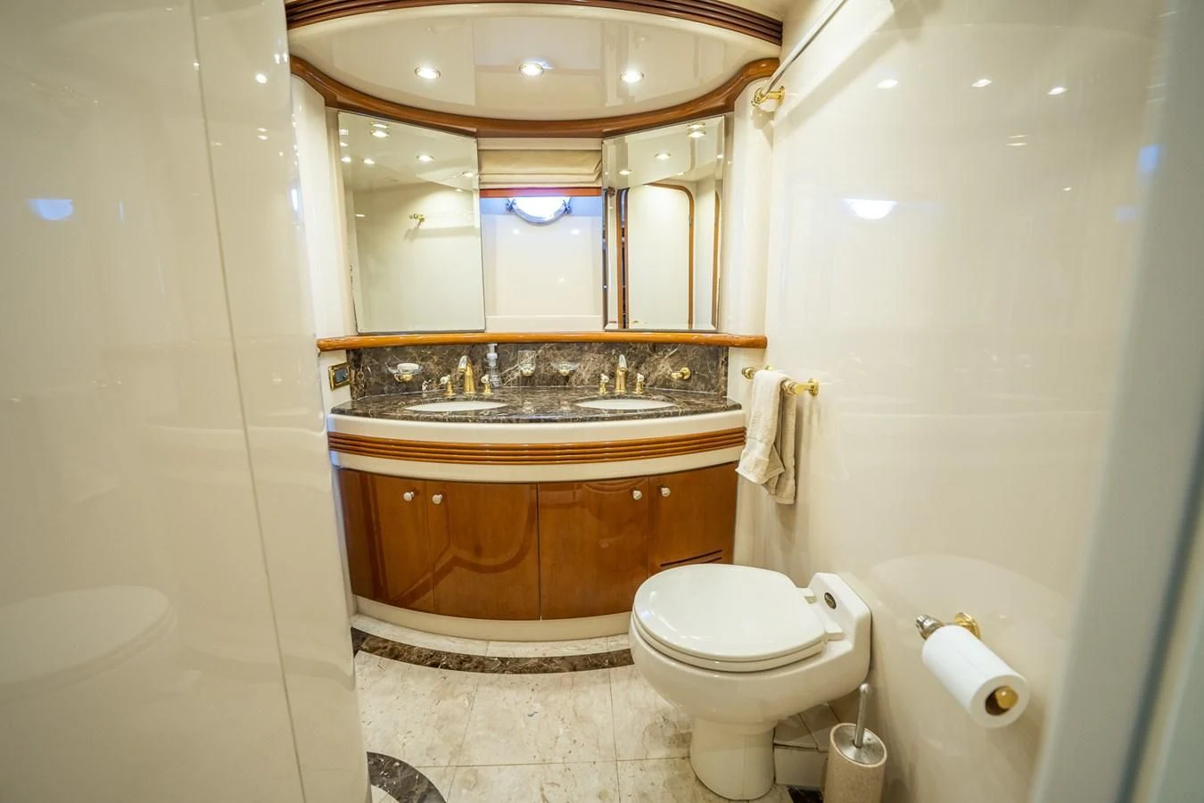 a bathroom with a toilet and a sink aboard 80 CARAT Yacht for Sale