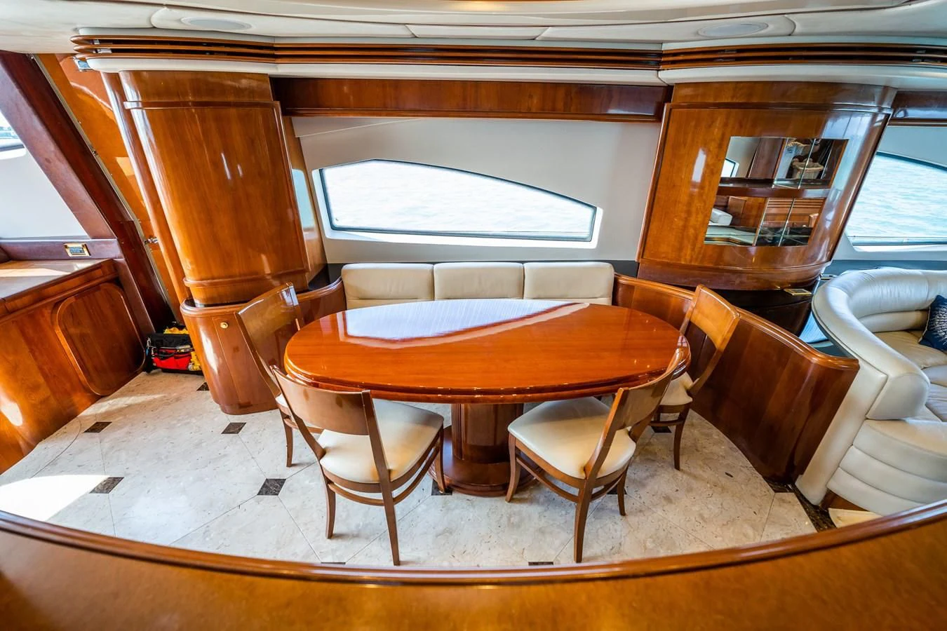 a table and chairs in a room aboard 80 CARAT Yacht for Sale