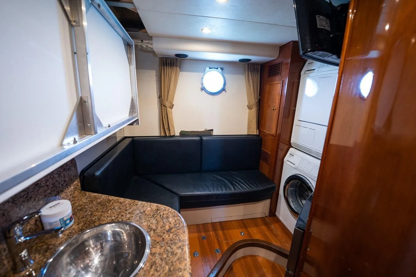 a small bathroom with a bed and sink aboard 80 CARAT Yacht for Sale