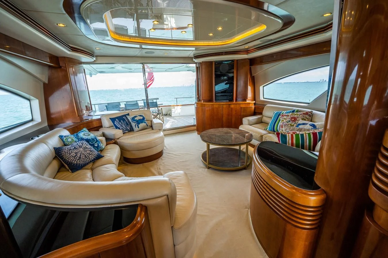a room with a table chairs and a window aboard 80 CARAT Yacht for Sale