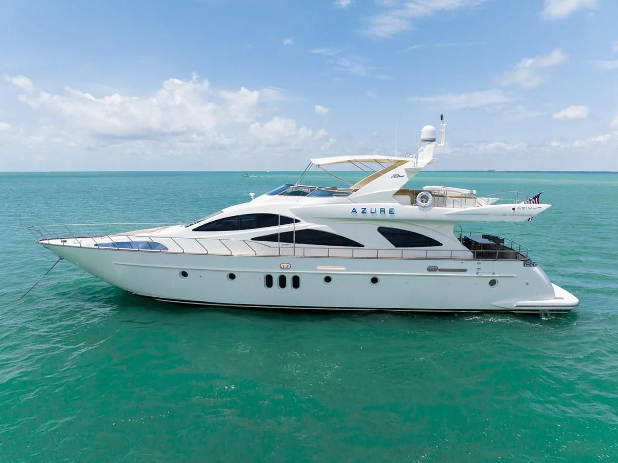 a white yacht in the water aboard 80 CARAT Yacht for Sale
