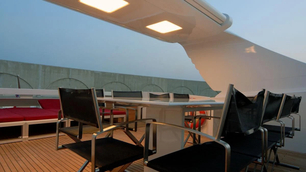a room with chairs and tables aboard MIKYMAR Yacht for Sale