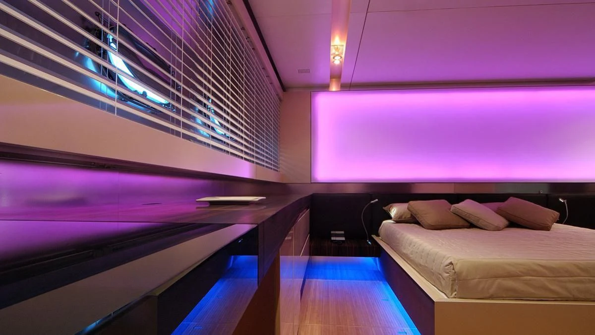 a room with a bed and a window aboard MIKYMAR Yacht for Sale