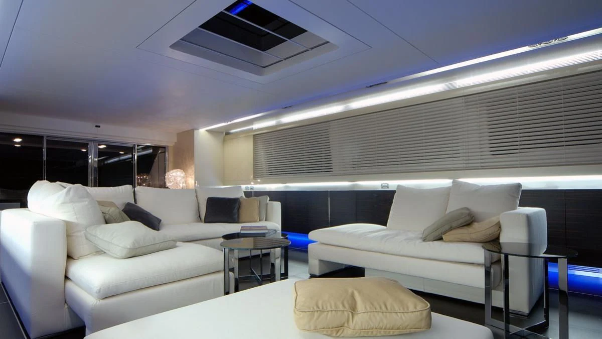 a room with couches and a table aboard MIKYMAR Yacht for Sale