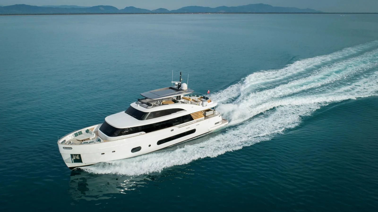a white boat on the water aboard ANDALA Yacht for Sale