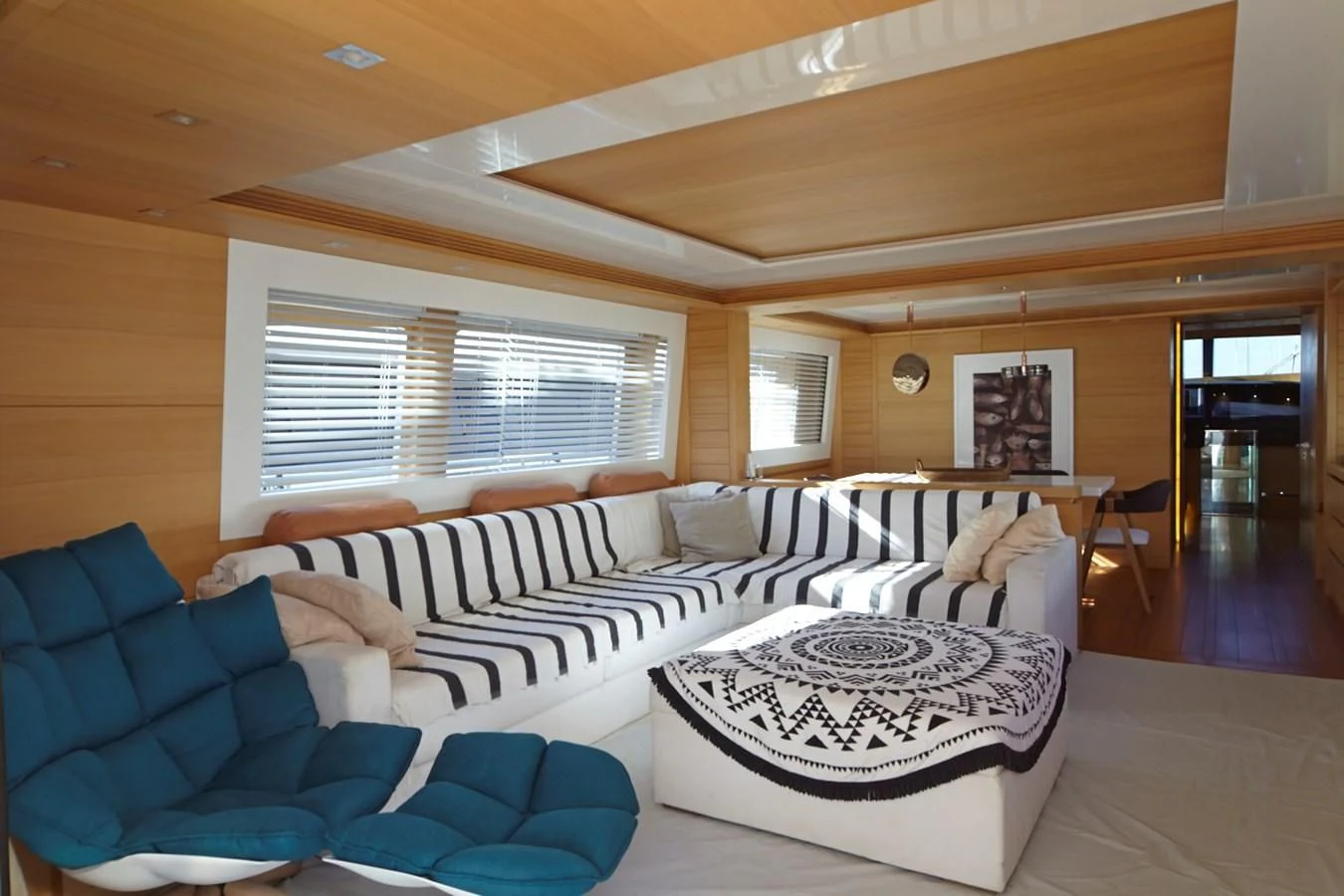 a living room with a couch and a table aboard GULU Yacht for Sale