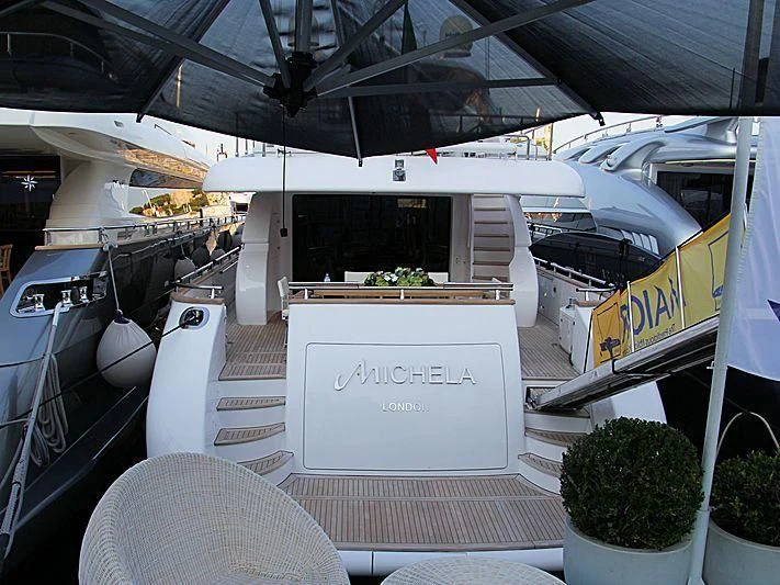 a white sign on a car aboard GULU Yacht for Sale