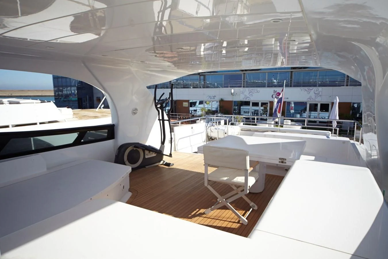a room with tables and chairs aboard GULU Yacht for Sale