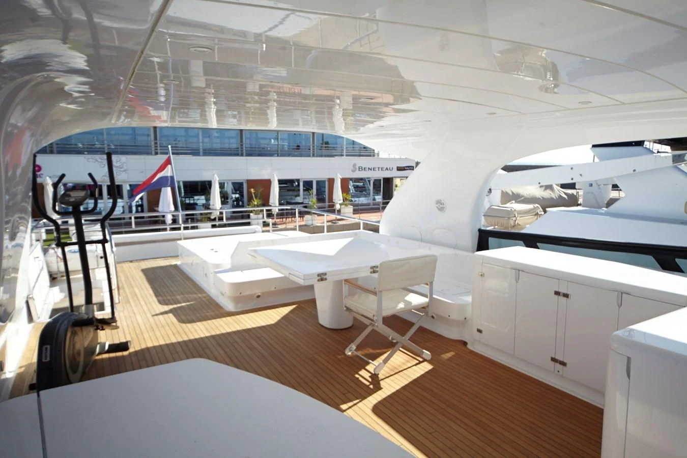 a large white boat on a wooden deck aboard GULU Yacht for Sale