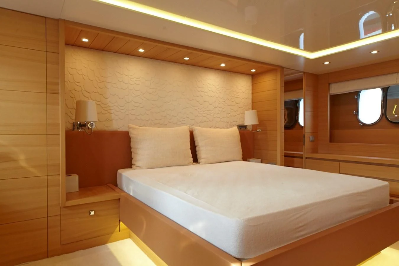 a bed in a room aboard GULU Yacht for Sale