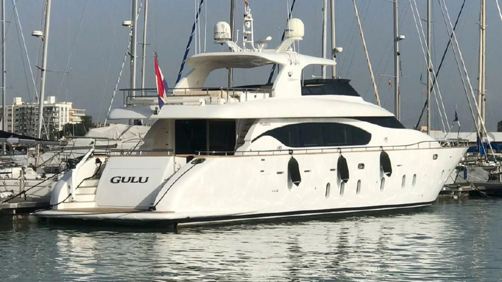 a white yacht in the water aboard GULU Yacht for Sale