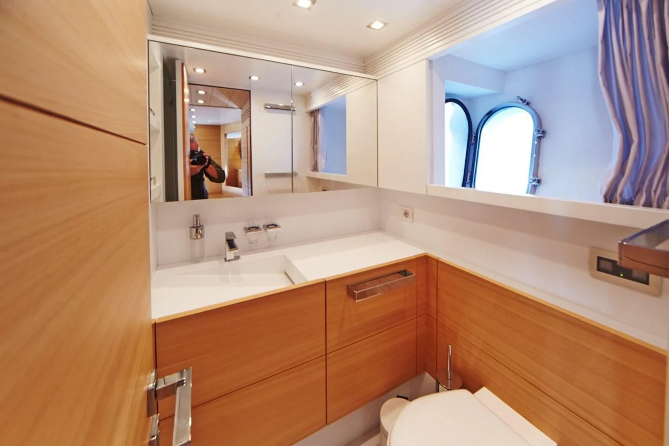 a bathroom with a large mirror aboard GULU Yacht for Sale