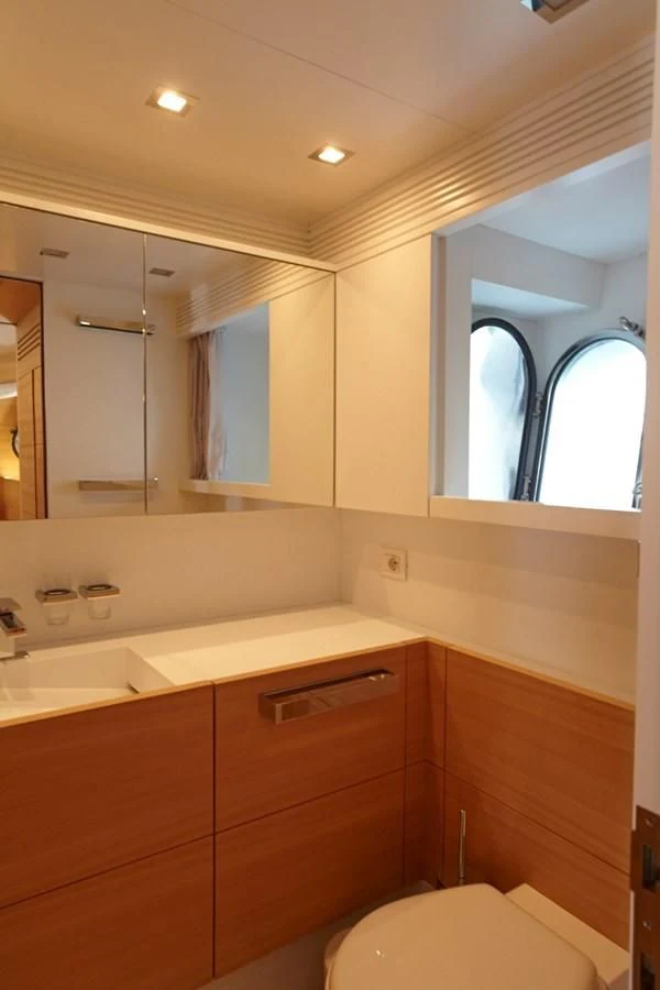 a bathroom with a large mirror aboard GULU Yacht for Sale