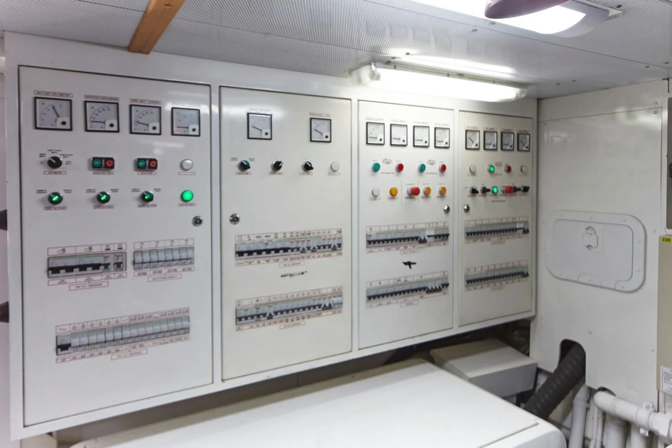 a room with several white cabinets aboard GULU Yacht for Sale
