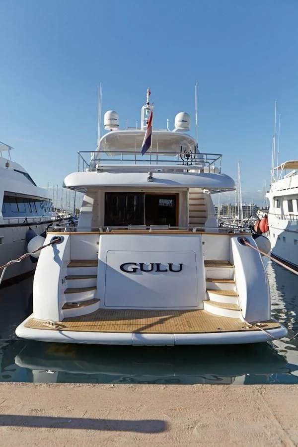 a boat on the beach aboard GULU Yacht for Sale