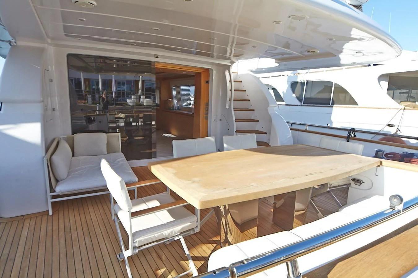 a boat with a table and chairs aboard GULU Yacht for Sale