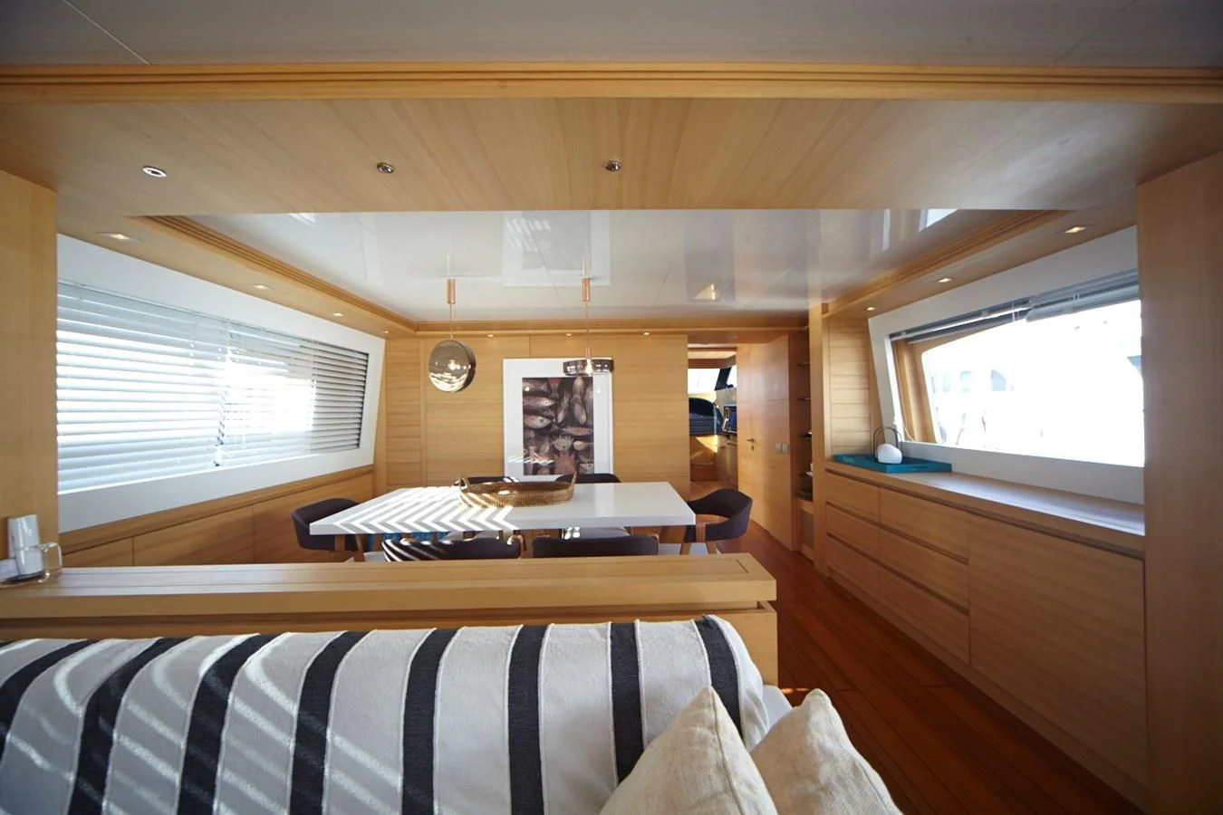 a room with a bed and a desk aboard GULU Yacht for Sale
