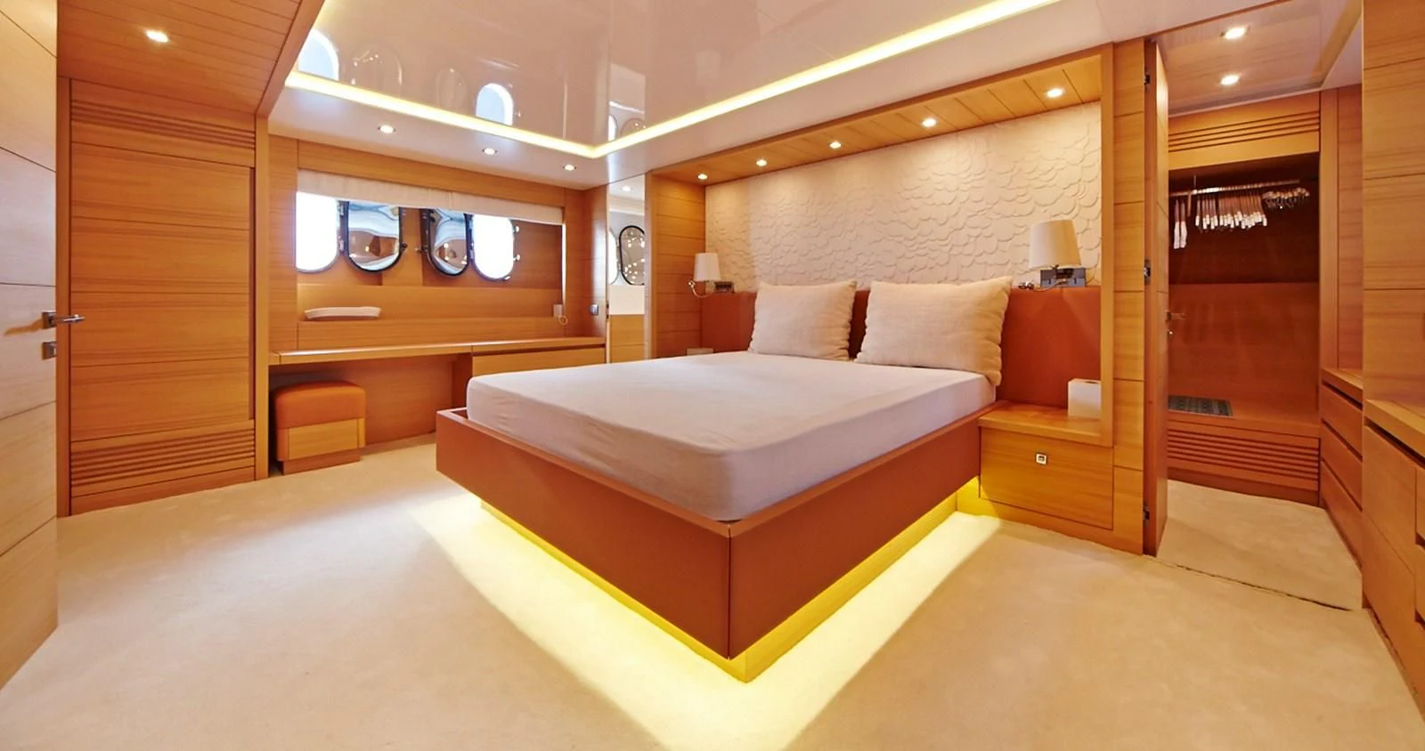 a room with a bed and a desk aboard GULU Yacht for Sale