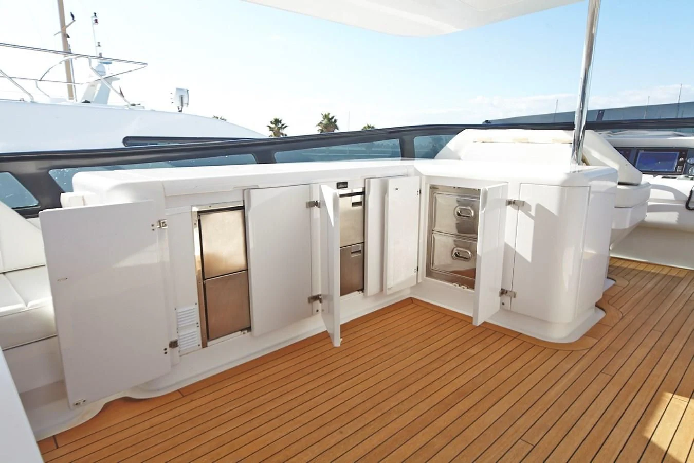 a white boat on a deck aboard GULU Yacht for Sale
