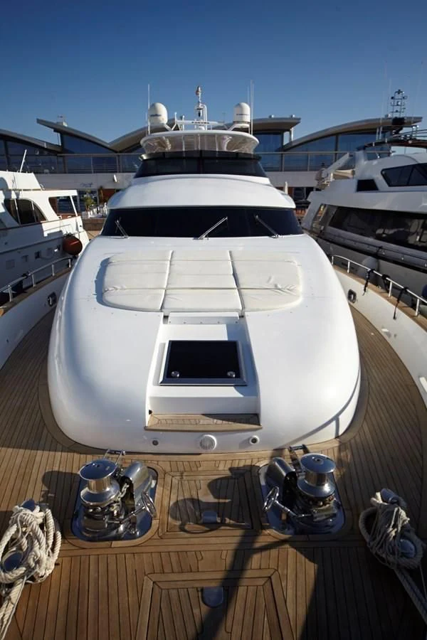 a white boat on a dock aboard GULU Yacht for Sale