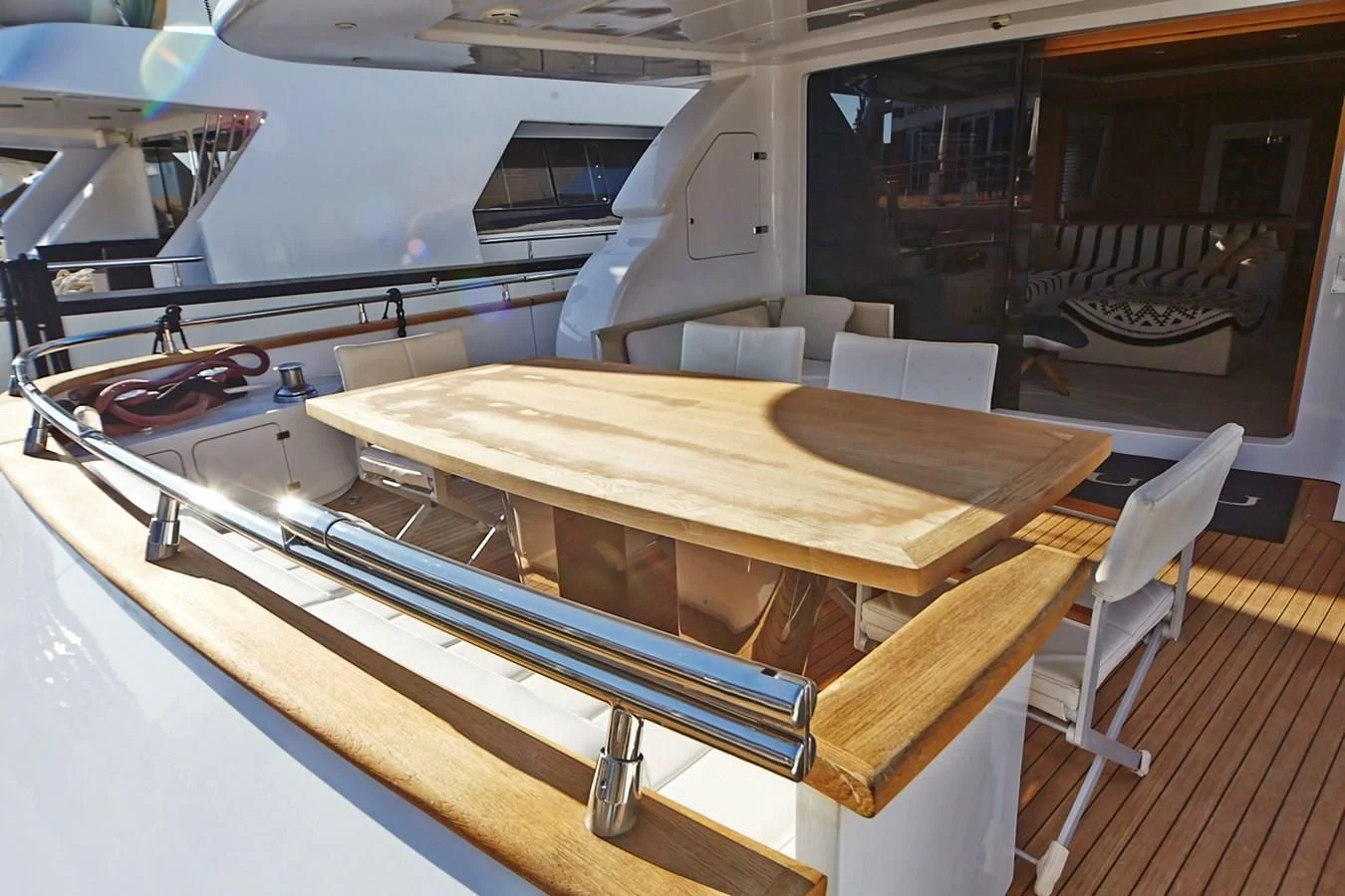 a table with chairs around it aboard GULU Yacht for Sale