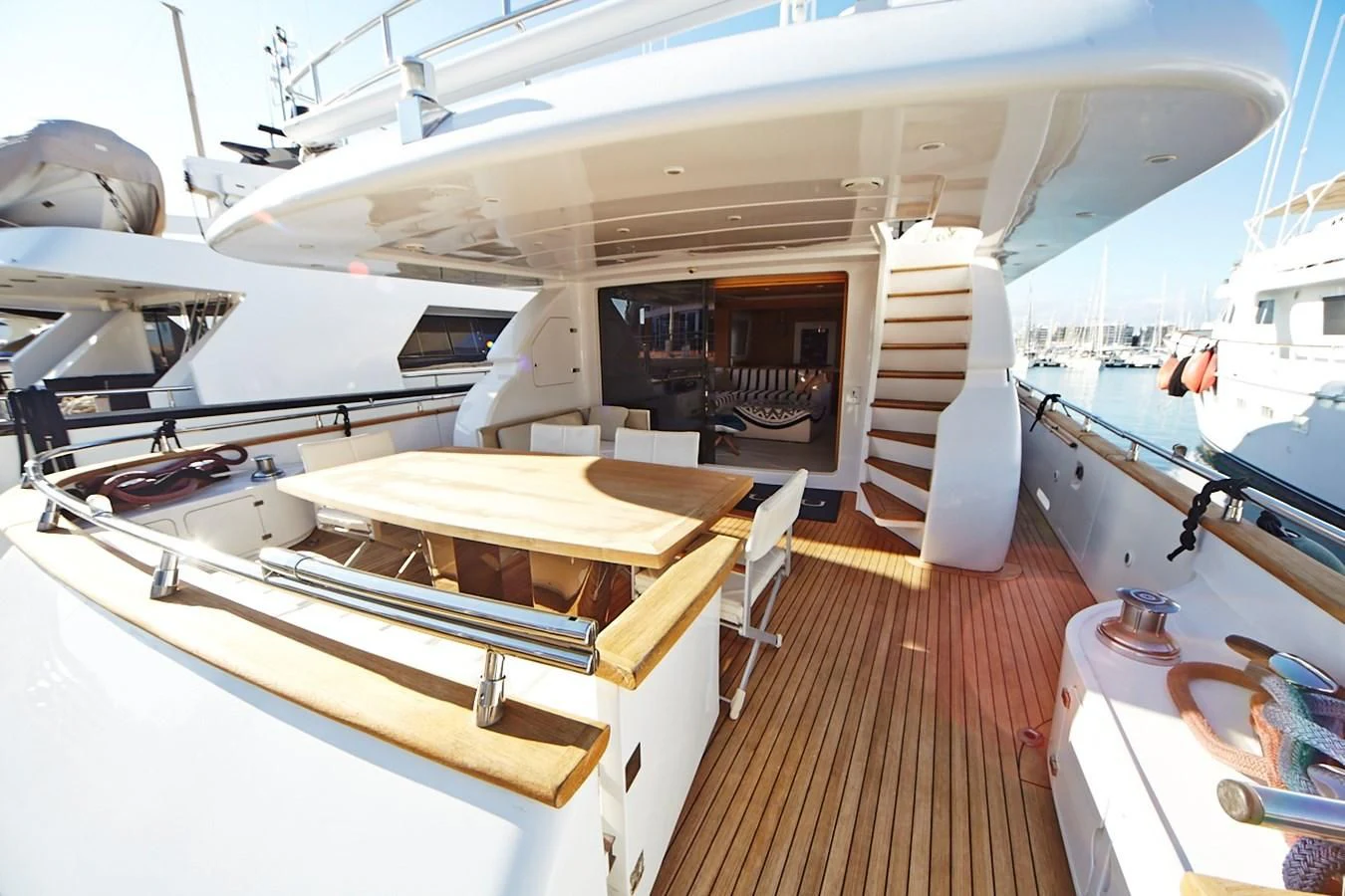 a boat with a table and chairs aboard GULU Yacht for Sale
