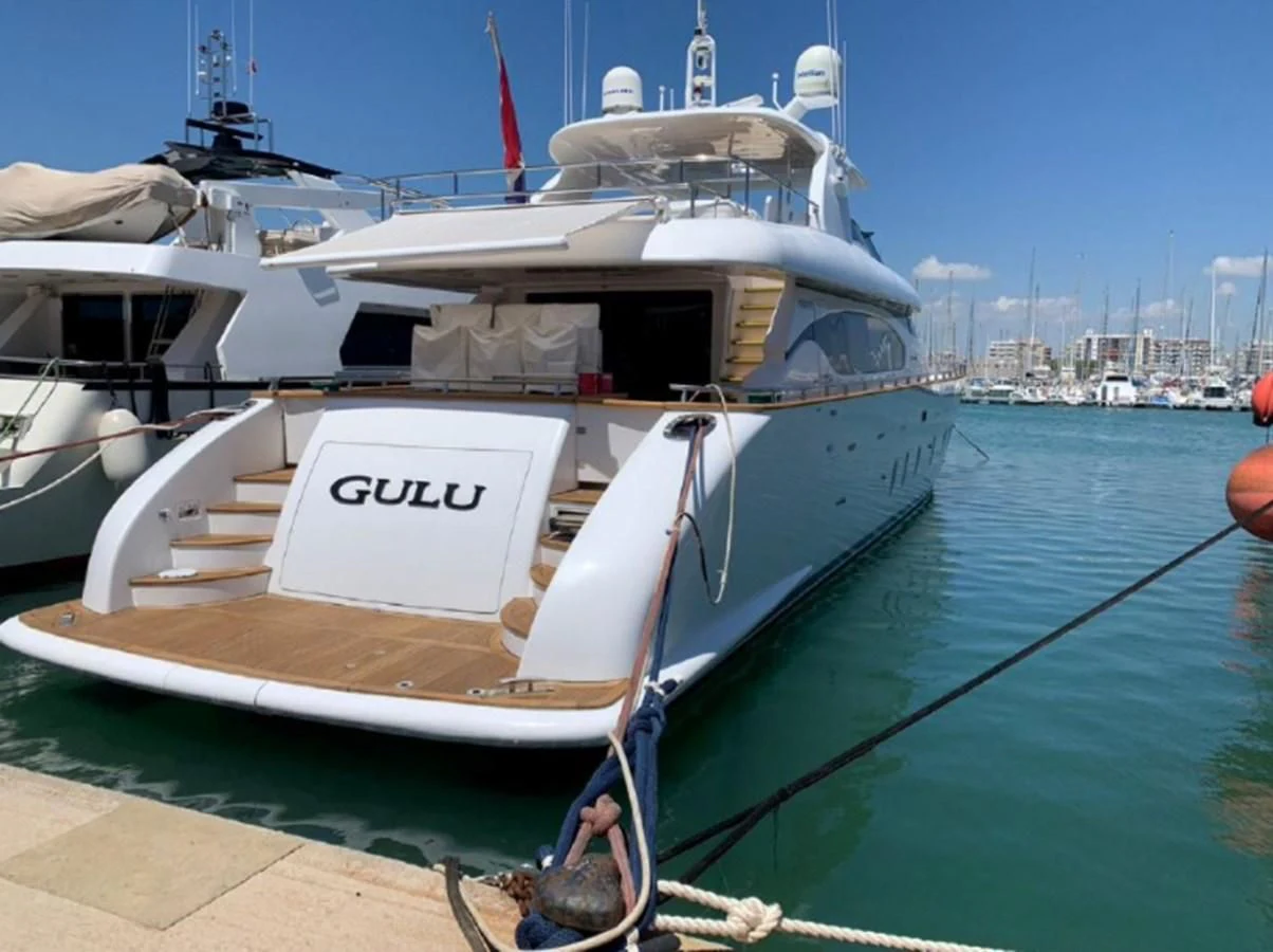 a boat docked at a pier aboard GULU Yacht for Sale
