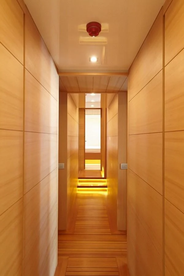 a hallway with a light fixture aboard GULU Yacht for Sale